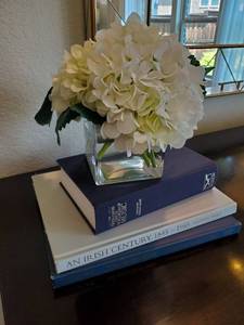 lot 1 image: Faux White Flower in Glass Vase with Books