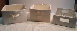 lot 1049 image: 2 ecru fabric storage containers and a basket