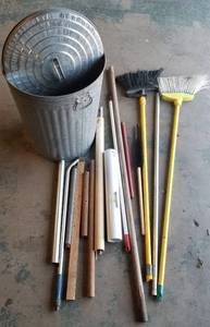 lot 1306 image: Trashcan of brooms, poles, pipes, etc