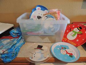 lot 80 image: Large tote of Christmas plates, napkins, table cloths, serving platters 390 mix pieces of clear cutlery
