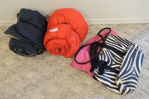 lot 75 image: Sleeping bags x 2 and carry bags x 2