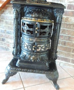 lot 18 image: Great Western Stove Co.  Leavenworth, Omaha and Denver Wood Burning Stove 38x20x23 Black cast iron VERY HEAVY Note - the front lower piece has a crack and SPLIT