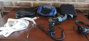 lot 86 image: CD case, fanny Pack, 2 car phone chargers for android, headphones and white suspenders