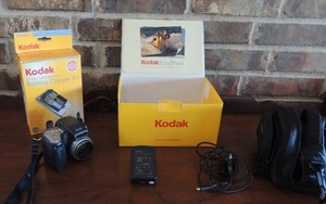 lot 89 image: Kodak camera in box   Kodak battery charger kit     camera bag 4.0 mega pixels