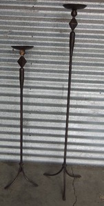 lot 125 image: 2 TALL METAL CANDLE HOLDERS -  Taller one is 50H, shorter one is 40H, -  BLACK WITH GOLD ACCENTS