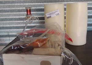 lot 135 image: Red and Gold Glass Candle stand with Elephant on top,  2 battery operated candle and assorted other candles