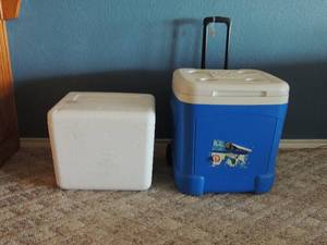 lot 151 image: Blue Igloo ice cube chest on wheels with handle     White Omaha meats Styrofoam ice chest