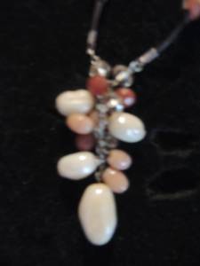 lot 24 image: Cream, tan and brown beaded necklace