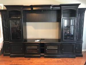 lot 126 image: Large Wall Entertainment Center- 10 doors,  fits a 42- 48 TV. Stands 77 width 117 ( CAN GO TO 14 FT) depth 22  comes in 9 pieces - FROM WAGON YARD IN GRANBURY