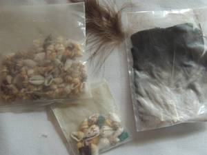 lot 115 image: Kachina Doll accessories- Feathers and Tiny Shells