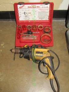 lot 312 image: Milwaukee hole saw kit and Dewalt electric drill