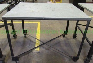 lot 143 image: Metal base and top rolling utility table. 34 x 37 x 46