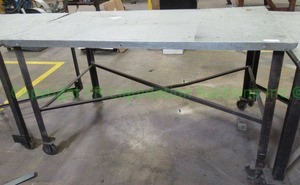 lot 145 image: Metal base and top rolling utility table. 36 x 37 x 61