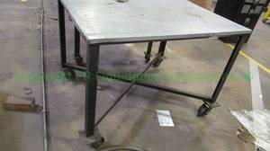 lot 146 image: Metal base and top rolling utility table. 34 x 37 x 47