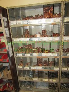 lot 229 image: Contents only of cubby shelves including copper fittings