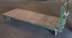 lot 5 image: Long platform  flatbed truck with metal frame and wood platform as shown.