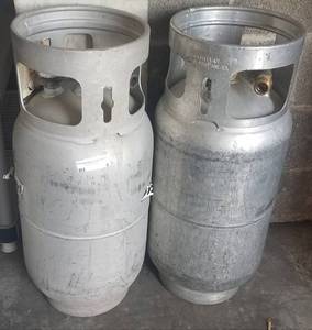 lot 6 image: Two LP -- propane tanks as shown. At least one appears to be partially full. You are bidding by the piece