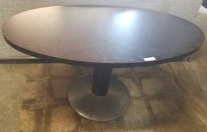 lot 35 image: Oval shaped wooden top table with metal base in stylecolorcondition shown.