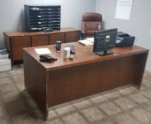 lot 48 image: Office lot including wooden desk, credenza, 24-compartment literaturemail organizer, and office chair. All other items shown are not included