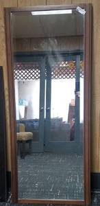 lot 60 image: Solid wood framed mirror in stylecolorcondition shown.