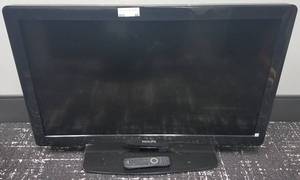lot 66 image: Philips flat screen TV with remote in stylemodelcondition shown.