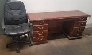 lot 79 image: Wooden office desk and office chair in stylecolorcondition shown.