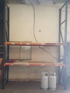 lot 119 image: Single section pallet rack in solid condition as shown. Buyer is responsible for proper breakdown. Contents not included PLEASE NOTE DELAYED PICK UP ON THIS ITEM BETWEEN 400 - 600 PM