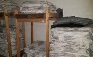 lot 133 image: Large lot of curtains that were used as furniture blankets as shown.
