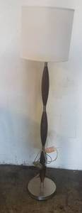 lot 231 image: Wood floor lamp in stylecolor shown. Condition varies. Please Note These items will be distributed on a First come - First served basis. You are bidding by the piece