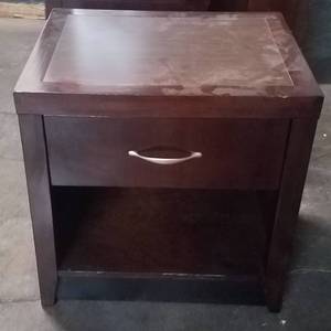 lot 381 image: Nightstand in dark finish in stylecolor shown. Condition varies. Please Note These items will be distributed on a First come - First served basis. You are bidding by the piece