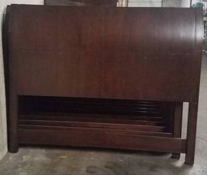 lot 423 image: Queen size headboard with platform bed in dark finish as shown. Condition varies. Please Note These items will be distributed on a First come - First served basis. You are bidding by the piece