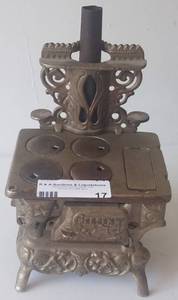 lot 17 image: Antique 1900s Crescent salemans sample cast iron stove in styelcolorcondition shown. Check it out