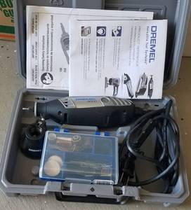 lot 84 image: Dremel 3000 with accessories in storage case as shown.