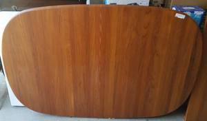 lot 86 image: Oblong teak wood table with 2 leaves as shown. No legs.