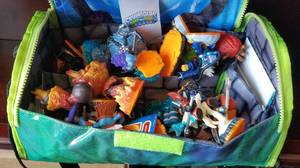 lot 102 image: Lot of Skylanders toys in storage bag as shown.