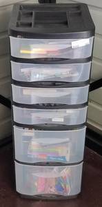 lot 107 image: 6-drawers plastic storage container with assorted office supplies as shown.