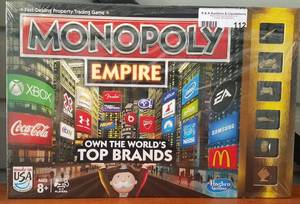 lot 112 image: New, unopened Monopoly Empire as shown.