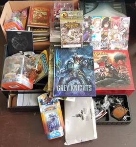 lot 146 image: Gaming cards, models, and more as shown.