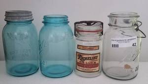 lot 42 image: Vintage mason canning jars as shown.