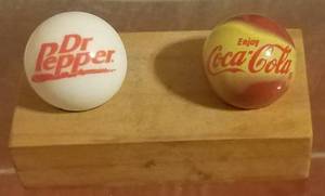 lot 10 image: VINTAGE COCA-COLA AND DR. PEPPER LARGE SHOOTER MARBLES WITH WOODEN DISPLAY AS SHOWN.