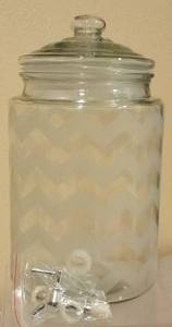 lot 23 image: KIRKLANDS GLASS BEVERAGE DISPENSER IN STYLE SHOWN. APPEARS TO BE IN UNUSED CONDITION.
