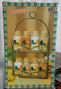 lot 48 image: ALCO 9-PIECE COUNTRYSIDE THEME SPICE RACK SET IN ORIGINAL BOX AS SHOWN.