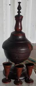 lot 53 image: VINTAGE WOODEN DECANTER AND CUPS SET IN STYLECOLORCONDITION SHOWN. MEASURES APPROX. 13.5 x 5.5.