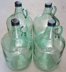 lot 59 image: LOT OF 4 ONE GALLON GLASS BOTTLES AS SHOWN.