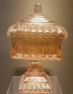 lot 78 image: VINTAGE FOOTED CARNIVAL GLASS WITH LID IN STYLECOLORCONDITION SHOWN. MEASURES APPROX. 4 x 6.5.