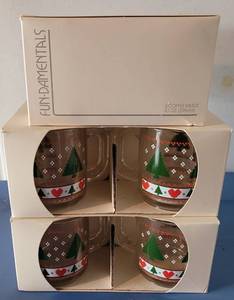 lot 99 image: VINTAGE FUN-DAMENTALS CHRISTMAS THEME COFFEE MUGS FROM DILLARDS IN ORIGINAL BOXES AS SHOWN. 12 COUNT.
