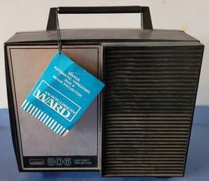 lot 114 image: VINTAGE MONTGOMERY WARD DUO EIGHT PROJECTOR MODEL 806 WITH ORIGINAL TAG STILL ON. CHECK IT OUT
