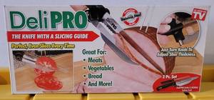 lot 126 image: DELI PRO THE KNIFE WITH A SLICING GUIDE IN ORIGINAL BOX AS SHOWN.