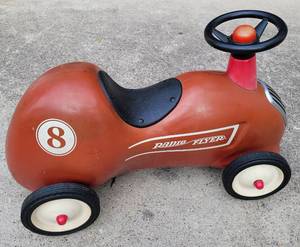 lot 177 image: VINTAGE RADIO FLYER LITTLE RED ROADSTER PUSH RACE CAR MODEL #8 AS SHOWN. MEASURES APPROX. 25 L x 16 H x 12 W.
