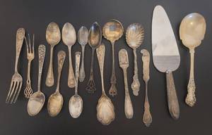 lot 215 image: 16 PIECES OF STERLING SILVER FLATWARE IN VARIOUS STYLESSIZESBRANDS AS SHOWN. WEIGHT IS APPROX. 405 GRAMS.